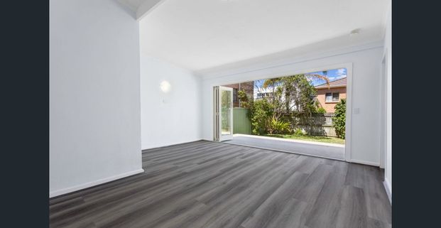 Family sized 2 Bedroom House + Home Office or Third Bedroom with Backyard - Photo 1