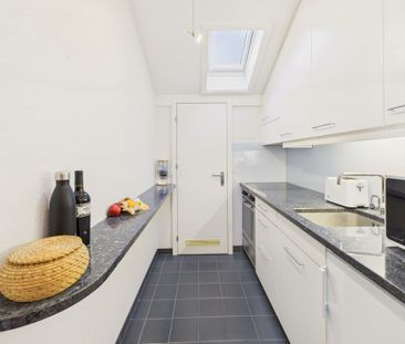 Charming 2.5-room penthouse apartment in Lyss - Photo 3