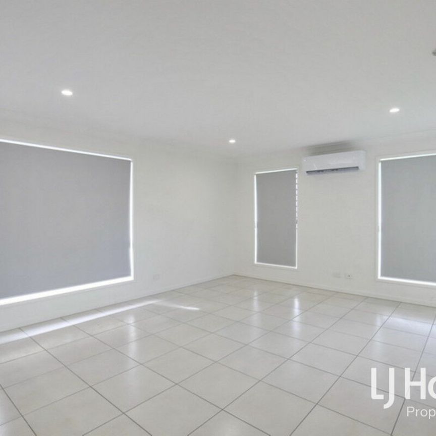 Modern Family Home in Logan Reserve! - Photo 1