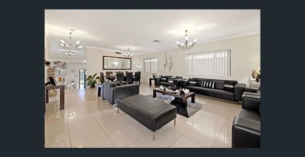 Contemporary 5-Bedroom Residence with Grand Living & Outdoor Elegance - Photo 1