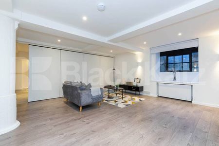 spacious 1 bedroom warehouse conversion with bi folding partition wall - Photo 5