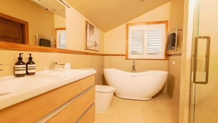 Exquisite 4-Bedroom Manor with Stunning Bush Views in Lucas Heights - Photo 3