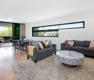 Modern Corner Apartment with Mountain Glimpses in Prime Location! - Photo 1