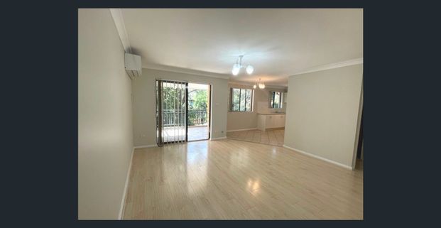 Spacious Top-Floor 2 Bedroom Unit with Lock-Up Garage & Balcony - Photo 1