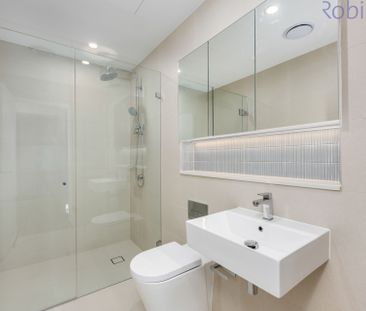 Modern split-level apartment with luxe finishes in a prime location. - Photo 3