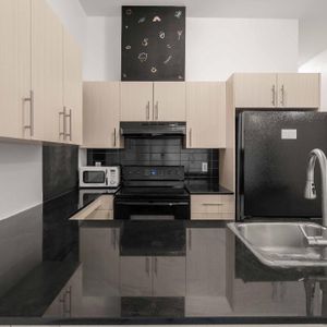 GRAND CONDO MODERNE 4 1/2 - STADE OLYMPIQUE / MÉTRO VIAU - Photo 2