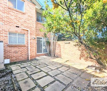 Two-Bedroom Brick Townhouse with Private Courtyard - Photo 1
