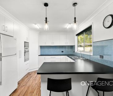 COMFORTABLE THREE-BEDROOM HOME WITH MODERN FEATURES - Photo 1