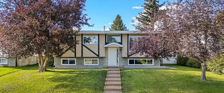 Beautiful Bi-level house with a single and Double Garage with four-post Hoist | Calgary - Photo 1