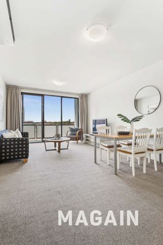 Spacious City Living with Expansive Wrap-Around Balcony & Secure Parking - Photo 5