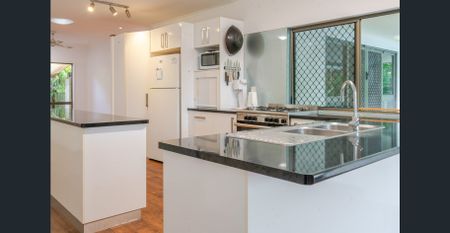 Charming 4-Bedroom Family Retreat with Pool & Solar in Mooroobool - Photo 3