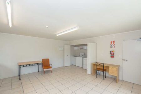 These fully furnished studio units have fresh carpet and paint, creating a bright, warm, and inviting space. - Photo 2