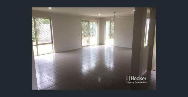 Spacious High-Set Family Home in Prime Location - Photo 1