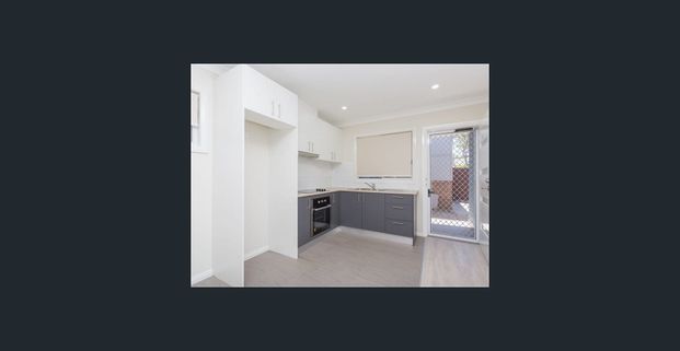 Neat Granny Flat with Natural Light - Photo 1