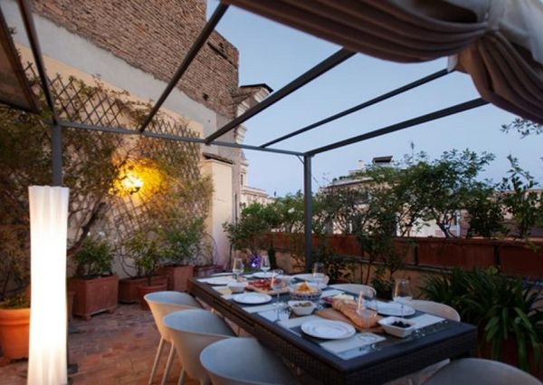 Attic-Monti: 1-6 month rentals. Spacious, furnished 3 Bedroom, 2 bath, living room, dining room, study and large panoramic terrace. Bright, silent, located in well kept Palazzo d’Epoca with elevator and doorman. Near transport and Metro.