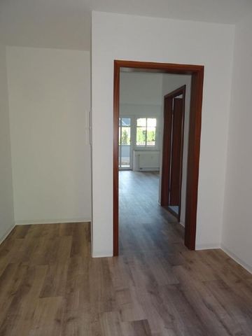 Zweiraum-EG-Wohnung mit Terrasse in TOP-Wohnlage! - Photo 2
