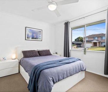 Family home with multiple living zones and large fenced yard - Photo 3