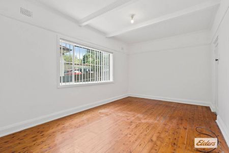 Neat & Tidy Family Home | Split-Level Living in Prime Location - Photo 2