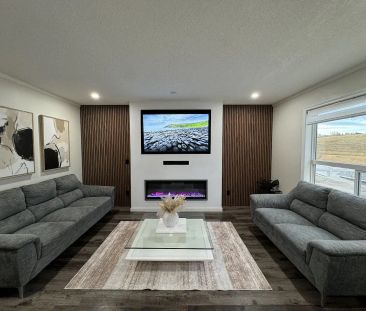 Modern, Clean, Two Story Main Floor in Tuscany! — 3 Bedrooms+ Den Main Floor - Photo 1