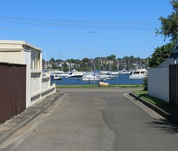 RENOVATED 1 BEDROOM FLAT WITH LARGE YARD AND WATER GLIMPSE - Photo 1
