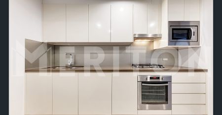 2 BEDROOM SPLIT LEVEL APARTMENT WITH PARKING NEXT DOOR TO EAST VILLAGE SHOPPING CENTRE! - Photo 3