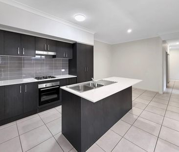 Charming 4-Bedroom Home in Prime Gregory Hills Location - Photo 6