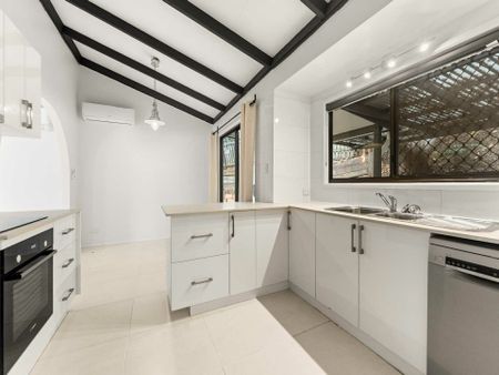 Discover Low-Maintenance Living with A/C & Tiled Floors - Photo 2