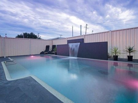 You will feel right at home in this five bedroom family home with a pool - Photo 2