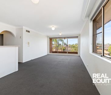 Top-Floor Apartment in a Sought After Lakeside Location - Photo 1