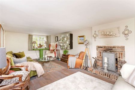 A pretty brick and flint detached cottage offering a wealth of charm and character with a delightful country garden in a tranquil yet convenient setting. - Photo 2