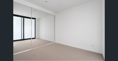 Positioned in the vibrant heart of Essendon, this stylish apartment is bathed in natural light and offers the perfect blend of comfort and convenience - Photo 5