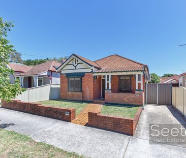 A full brick character home brimming with original charm, offering ... - Photo 2