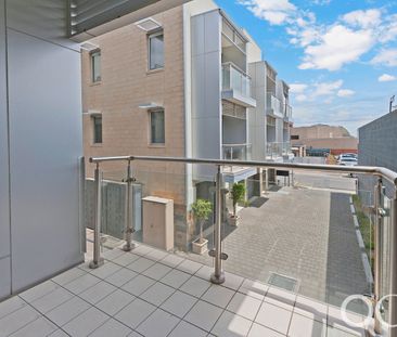 Open the Door to City Serenity with a Private Balcony - Photo 4
