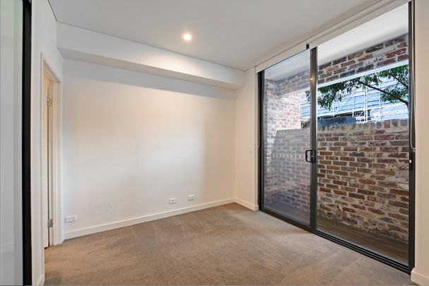 Split-Level I Courtyard Apartment I Lockup Garage - Photo 1