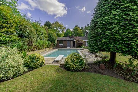 A five bedroom family home arranged over two floors, with a mature south west facing garden and swimming pool. - Photo 2