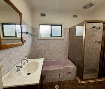 Spacious Three-Bedroom Residence on a large corner block - Photo 3