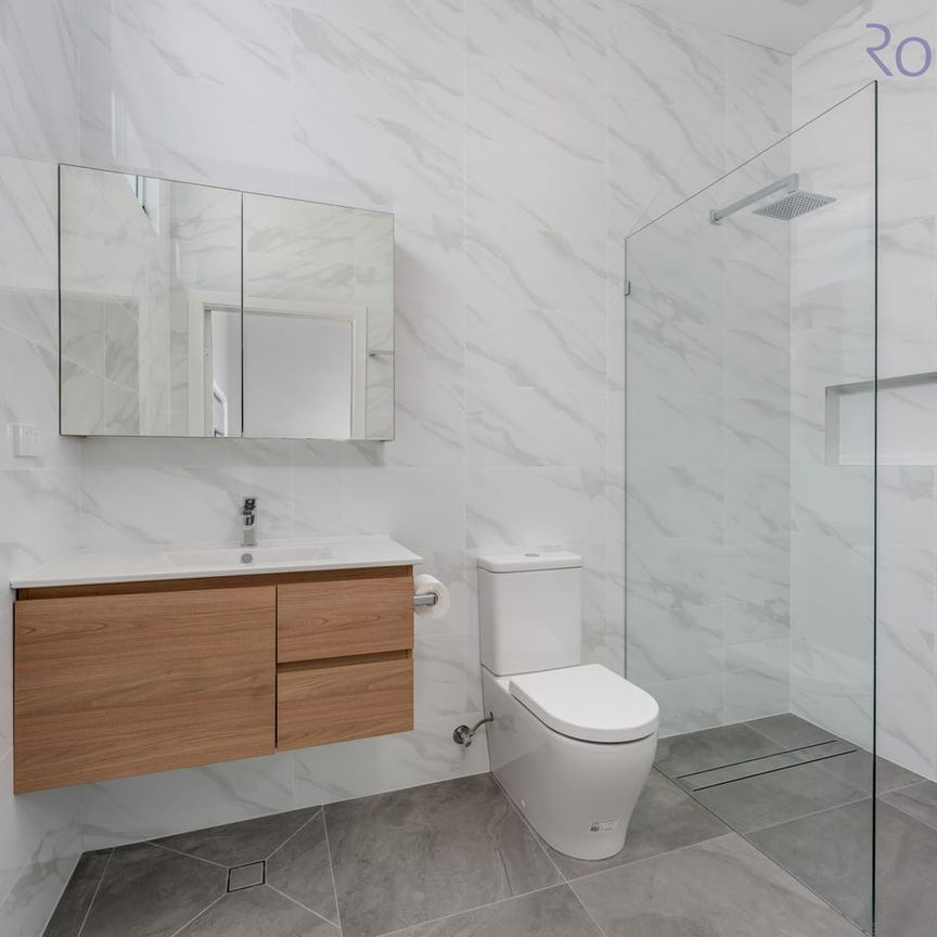 Renovated 3 bedroom home with a white picket fence - Photo 1