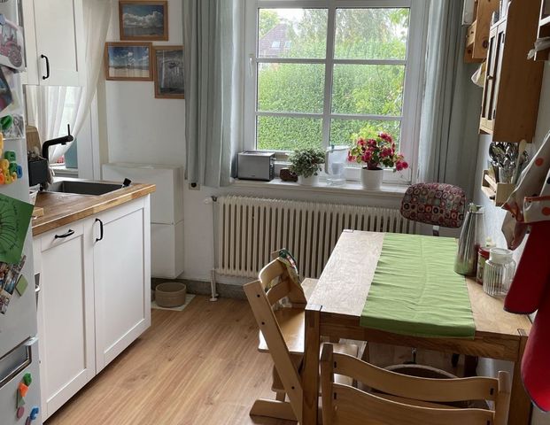 Charmante 3-Zimmer-Wohnung mit Kamin & Gartenanteil in Kiel-Hassee - Foto 1