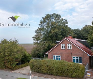 Traumhafte Obergeschosswohnung – modern, lichtdurchflutet und nur w... - Foto 1