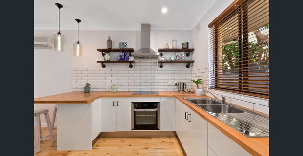 Stylish Beachside Unit Offering Modern Coastal Living - Photo 1