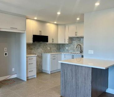 Condo 4 1/2 entièrement rénové vue fleuve - Photo 1