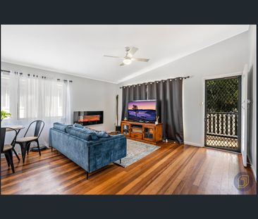 Flawlessly Renovated Family Haven with Dual-Level Flexibility - Photo 1