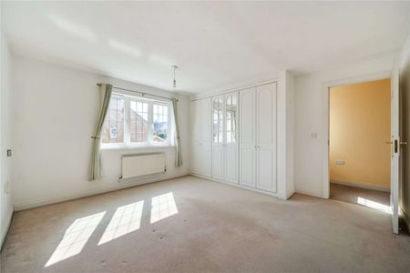 A practical detached four-bedroom home with integral garage. - Photo 3