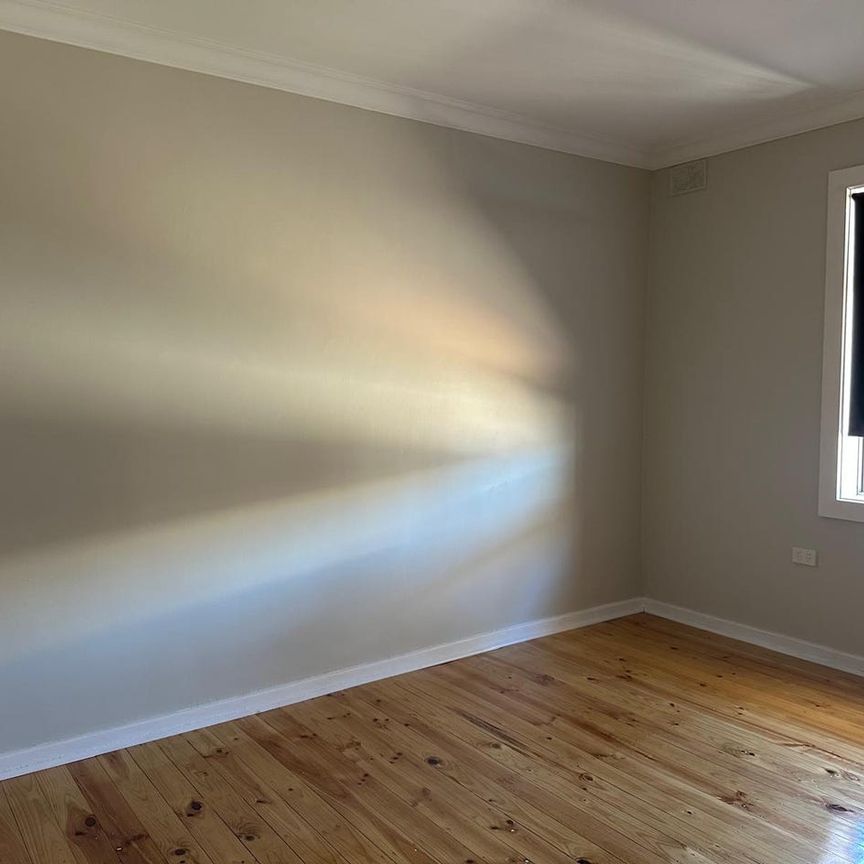 Family Home with Modern Comforts and Spacious Backyard - Photo 1