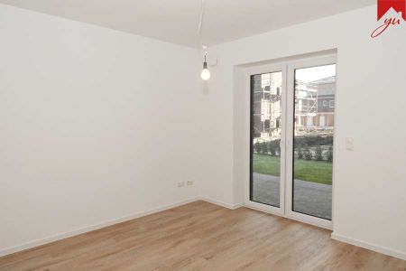 Attraktive Erdgeschosswohnung im schönen Neubau und zentraler Lage von Wiesmoor! - Photo 2