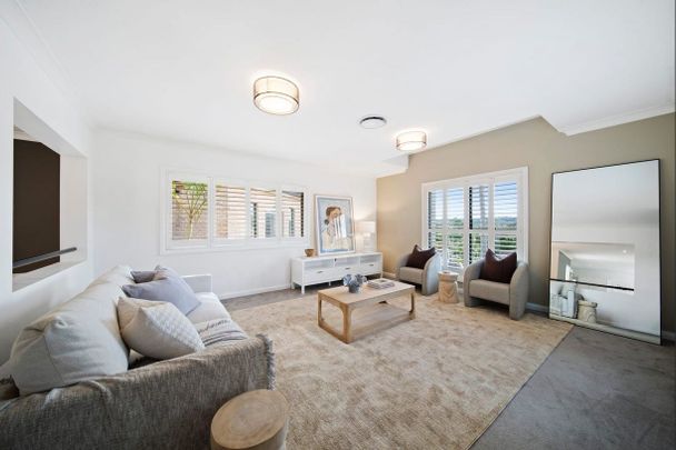 LIGHT-FILLED FAMILY RETREAT OFFERING SPACE AND CONVENIENCE - Photo 1