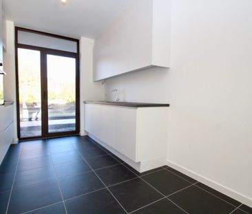 Gelijkvloers nieuwbouwappartement met zonnig terras! - Photo 1