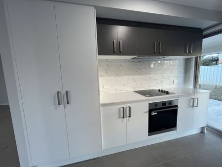 Stylish Modern Home with Ducted A/C & Water Included - Photo 5