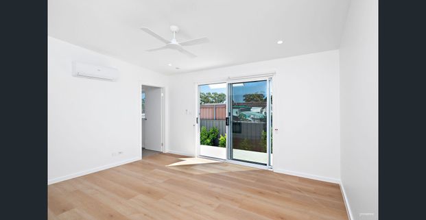 BRAND NEW ARCHITECTURALLY DESIGNED HOME WITH OFF-STREET PARKING - Photo 1