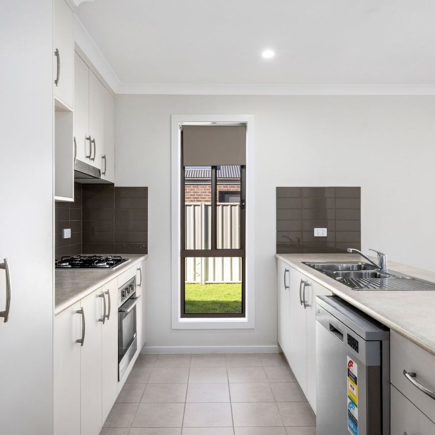 SPACIOUS 4-BEDROOM HOME WITH MODERN COMFORT - Photo 1